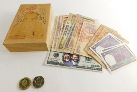 Banknotes, comprising Chinese, Uganda, Indian and others, a £2 World Cup coin and a £2 Dove of Peace collectors coin. (1 box)