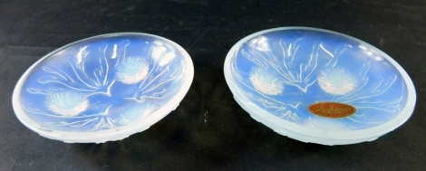 A pair of Sabino French glass saucers, decorated with seaweed and flower heads, labelled and marked Sabino France, 10cm diameter. (2)