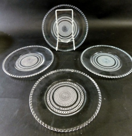 A set of four 20thC Lalique saucers, each with a bead border and centre, marked beneath R. Lalique, 17cm diameter. (4)