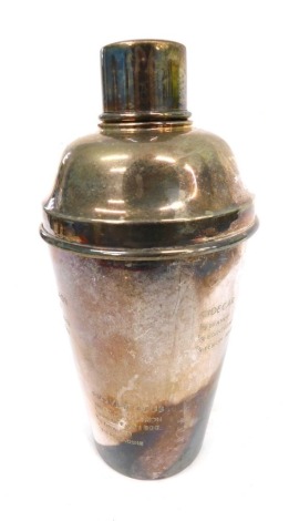 A 20thC silver plated cocktail shaker, decorated with recipes to the body, removable lid and top, 24cm high.