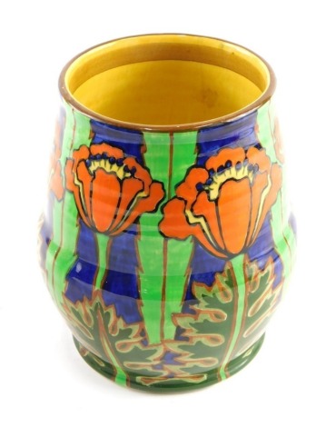 A 20thC Art Nouveau Bursleyware pottery vase, vibrantly decorated with flowers, predominately in green, yellow and blue, marked with raised number 124 beneath, 15cm high.