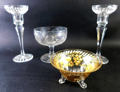 An early 20thC glass bowl, gilt etched with leaves, berries and flowers on triple scroll feet, unmarked, 13cm diameter, further glassware, a pair of candlesticks Stuart Crystal, etc. (a quantity)