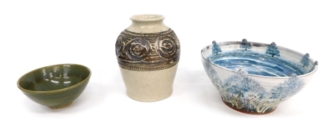 Various studio pottery, a Purbeck vase with a raised geometric banding on a speckled cream ground labelled beneath, 21cm high, A Not Him Who Seeks Cease Until He Finds and When He Finds... ribbed pottery bowl, and a further plain green studio pottery bowl