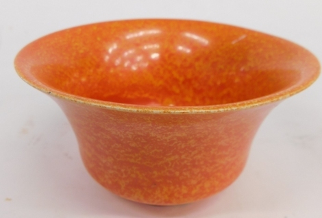 An early 20thC Royal Lancastrian orange pottery bowl, in the manner of Radford, vibrantly decorated with speckle glaze, impressed marks beneath, 13cm diameter.