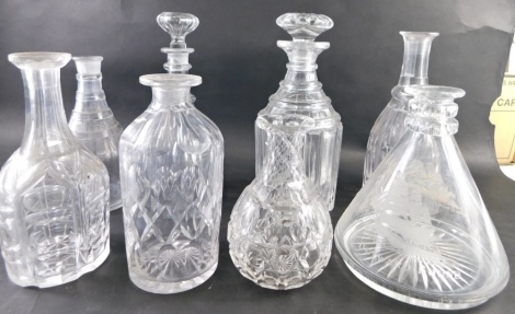 Various cut glass and other decanters, one with compressed floral stopper, 27cm high, engraved ship's decanter, etc. (a quantity, some lacking stoppers)