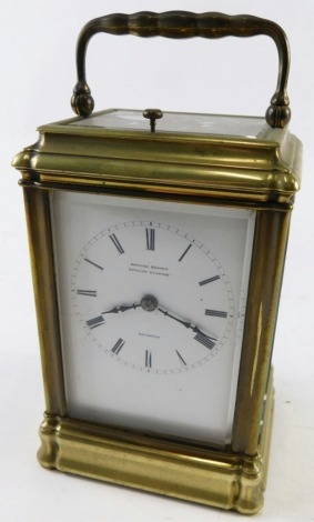 A 20thC brass repeating carriage clock, the 6cm wide back plate stencilled with a Roman numeric dial, marked Edward Bright Pavilion Buildings Brighton, in a five part glazed case, with swing handle, visible barrel movement, striking on a bell, with repeat