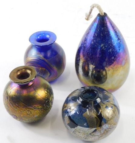 Various Isle of Wight style opalescent glass vases, to include one predominantly in purple, circular form, baluster shaped vase, another globular with gilt highlights, 9cm high, etc. (a quantity)