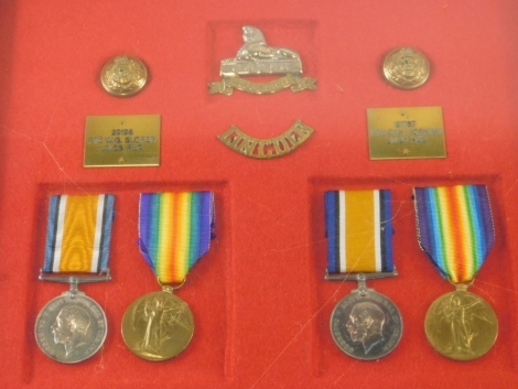 A cased World War I medal group, comprising Campaign and Victory medal, and another pair of Campaign and Victory medals, in a case with Lincolnshire cap badges and buttons, marked PTE WG Slope Lincs Reg, and PTE C W Hopkins Lincs Reg, the case 33cm x 36cm