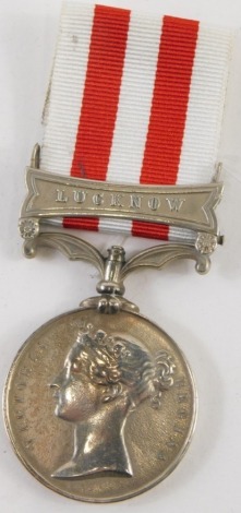 A Victorian India medal, unmarked, the ribbon with Lucknow clasp.