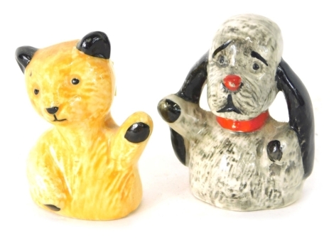 A pair of pottery figures, Sooty and Sweep, 6cm high, with card written: The Figures Were Given Away by Harry Corbett and Are Not for Sale. (2)