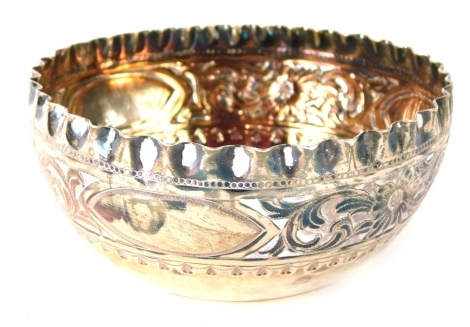 A Victorian silver sugar bowl, with an embossed and repousse decoration of flowers, scrolls, etc., Sheffield 1891, 2.42oz.