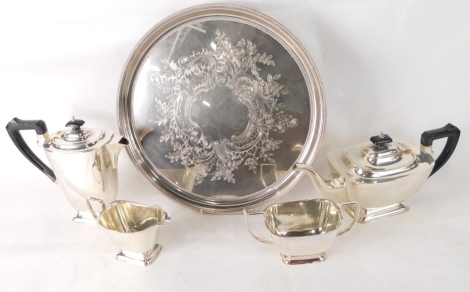 A 20thC Art Deco four piece silver plated tea set, with ebonised handle and knop and an engraved silver plated tray. (5)