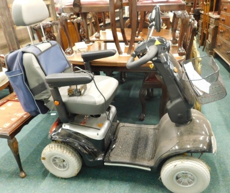 A Shop Rider Cadiz S-889SL four wheel mobility scooter, with bag, battery pack and instructions.