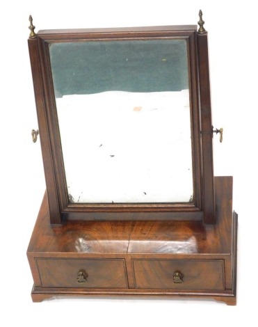 A late 19thC mahogany table mirror, with rectangular bevelled glass flanked by square tapering supports, above two drawers, on bracket feet, 49cm high, 37cm wide, 23cm deep.