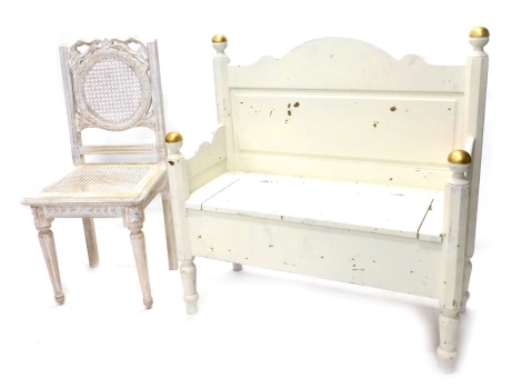 A cream painted bench, with hinged seat on turned legs, with gilt highlights, 104cm high, 101cm wide, 42cm deep, and a painted Indian side chair. (2)