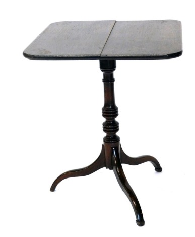 A 19thC oak tilt top table, the oblong top on turned stem and triple sabre legs terminating in compressed spade feet, 97cm high.