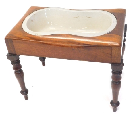 A 19thC mahogany bidet, of rectangular form, with square top on turned legs, 47cm high, 58cm wide, 35cm deep.