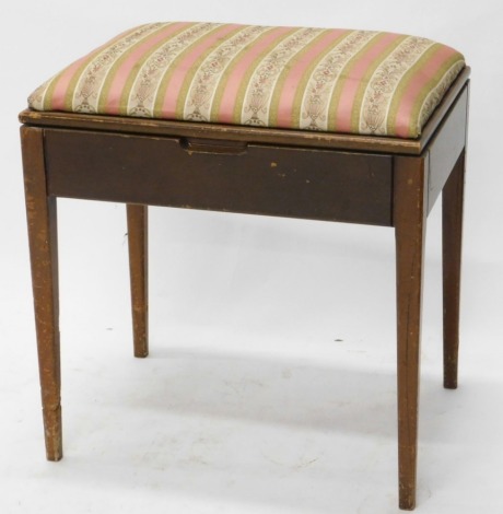 An early 20thC mahogany piano stool, with a hinged lid overstuffed in Regency stripe material, with plain interior, on tapering legs, 51cm high, 51cm wide, 39cm deep. (AF)