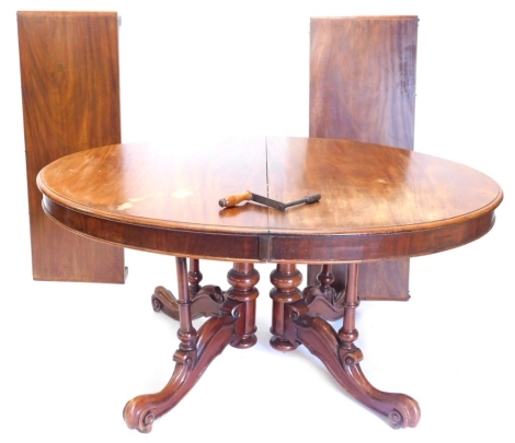 A Victorian mahogany D end wind out dining table, with heavy scroll feet with two leaves and winder, 72cm high, 120cm deep.