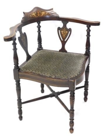 A 19thC shield back inlaid corner chair, with shaped top, turned supports, overstuffed seat an turned legs, 72cm high.