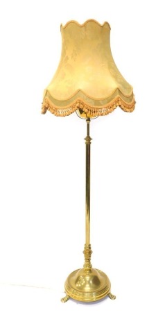 A brass telescopic standard lamp, with electrical feature and floral shade, 181cm high. WARNING! This lot contains untested or unsafe electrical items. It is supplied for scrap or re-conditioning only. TRADE ONLY