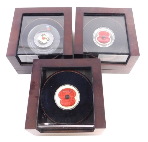 A Masterpiece Poppy Coin silver Royal British Legion cased poppy, and two others, each cased 19cm wide. (3)