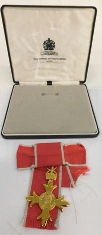 An OBE award medal, awarded to an ex chairwoman of the British Legion, in Toy, Kenning and Spencer Limited case, 14cm wide.