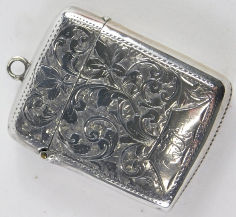 A Victorian silver Vesta case, with scroll decoration, on a plain ring top with match strike base, initialled, Birmingham 1896, 5cm high, 0.7oz.