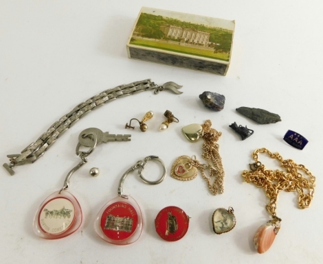 A small group of costume jewellery, comprising mainly key chains and necklaces, and an interesting heart shaped pendant with German soldier scene. (a quantity)