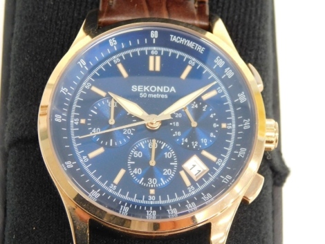 A Sekonda 50 meter tachymeter wristwatch, the blue 3.5cm dial with gilt coloured baton points and numerals, with three subsidiary hands and date aperture, cased with paperwork.