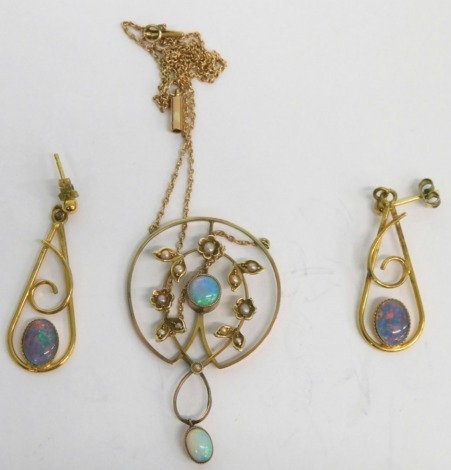 A matched Art Nouveau jewellery set, comprising floral and garland drop pendant, set with opal, 4cm high, and two club shaped earrings similar, unmarked. (3)