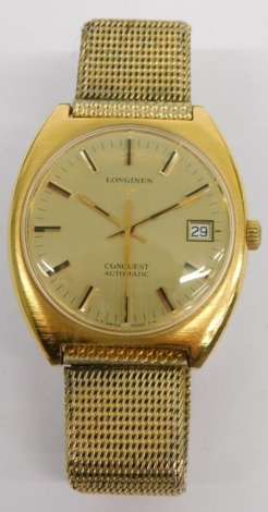 A 1970s Longines gold plated Conquest Collection wristwatch, with 3cm diameter dial, with baton numerals and pointers and date aperture, with a mesh work bracelet, with information from Longines in associated box.