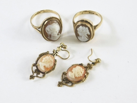 A 9ct gold cameo ring, similar pair of gold plated earrings, 3.5cm high, and a further 9ct gold cameo ring. (4)