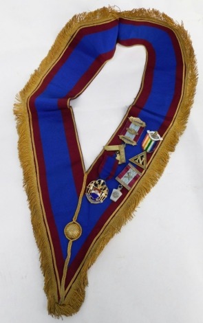 A Masonic sash, set with four jewels, silver gilt set square marked Presented to Wor Bro F Patman November 1935, a Heneage Ark Marineres Lodge number 188 N silver gilt jewel, and two others, on a Lindum sash.