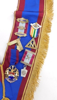 A Masonic sash, set with four jewels, silver gilt set square marked Presented to Wor Bro F Patman November 1935, a Heneage Ark Marineres Lodge number 188 N silver gilt jewel, and two others, on a Lindum sash. - 2