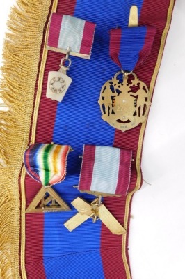 A Masonic sash, set with four jewels, silver gilt set square marked Presented to Wor Bro F Patman November 1935, a Heneage Ark Marineres Lodge number 188 N silver gilt jewel, and two others, on a Lindum sash. - 3