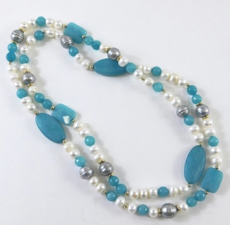 A costume jewellery beaded necklace, with faceted faux and blister pearls, and blue hardstone oblong beads, on a knotted string strand, 86cm long overall, boxed.