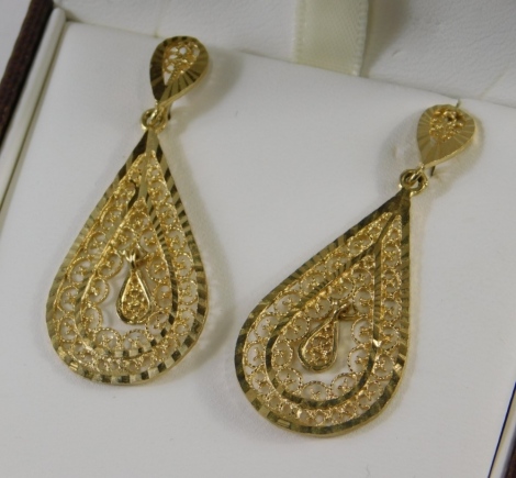 A pair of teardrop earrings, each of filigree pierced design, Middle Eastern in style, white metal stamped 9ct sil, 3g all in.