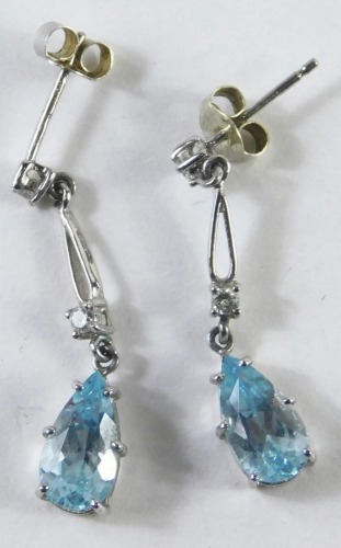 A pair of 9ct white gold aquamarine and diamond drop earrings, each with a tiny diamond set stud and drop, with teardrop aquamarine, white gold stamped 375, 1.8g all in, boxed.