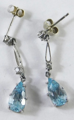 A pair of 9ct white gold aquamarine and diamond drop earrings, each with a tiny diamond set stud and drop, with teardrop aquamarine, white gold stamped 375, 1.8g all in, boxed.