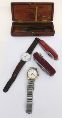 An Accurist wristwatch, the 4cm diameter dial with baton pointers and numerals, marked 17 Jewel Shock Master, a Rukla wristwatch, two Swiss army style knives, a mahogany cased part scalpel set, the blades marked Hilliard, Edinburgh, and a cat brooch. (a q