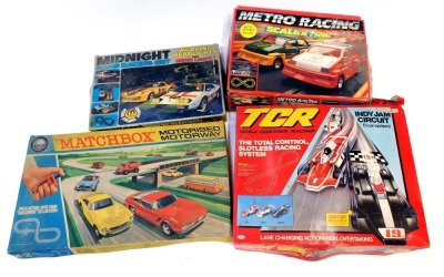 Slot car sets, comprising a Matchbox M2 motorised motorway, Ideal Total Control racing control set, Scalextric Metro Racing set and a Kodak Toys Midnight racing set with working headlights and rear lights. (4)