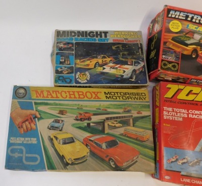 Slot car sets, comprising a Matchbox M2 motorised motorway, Ideal Total Control racing control set, Scalextric Metro Racing set and a Kodak Toys Midnight racing set with working headlights and rear lights. (4) - 2