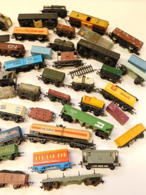 Hornby, Triang, and other rolling stock, including brake vans, milk tankers, Esso tankers, Schweppes Tonic Water wagon, Grimsby Fish van, etc. (1 box) - 2