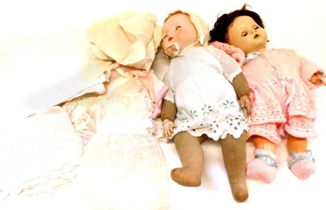 An Armand Marseille bisque headed doll, stamped AM Germany, a Pedigree doll, and dolls clothing. (a quantity)