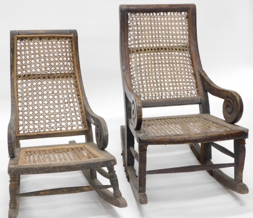 A pair of child's rocking chairs, with cane seats.