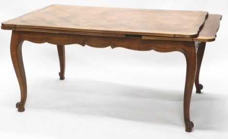 A Continental chestnut serpentine centre table, with parquetry top, and cabriole legs, 74cm high, 155cm x 100cm.