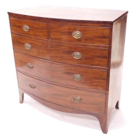 An early 19thC mahogany bow front chest of two short and three long graduated drawers, with oval pressed back plate handles, and splay feet, 108cm wide.