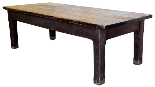 A 19thC pine plank top refectory table, on chamfered square legs, 76cm high, 244cm wide, 104cm deep.