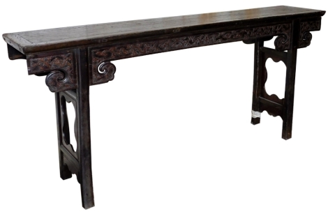 A Chinese hardwood altar table, with carved frieze, 91cm high, 210cm wide, 40cm deep.